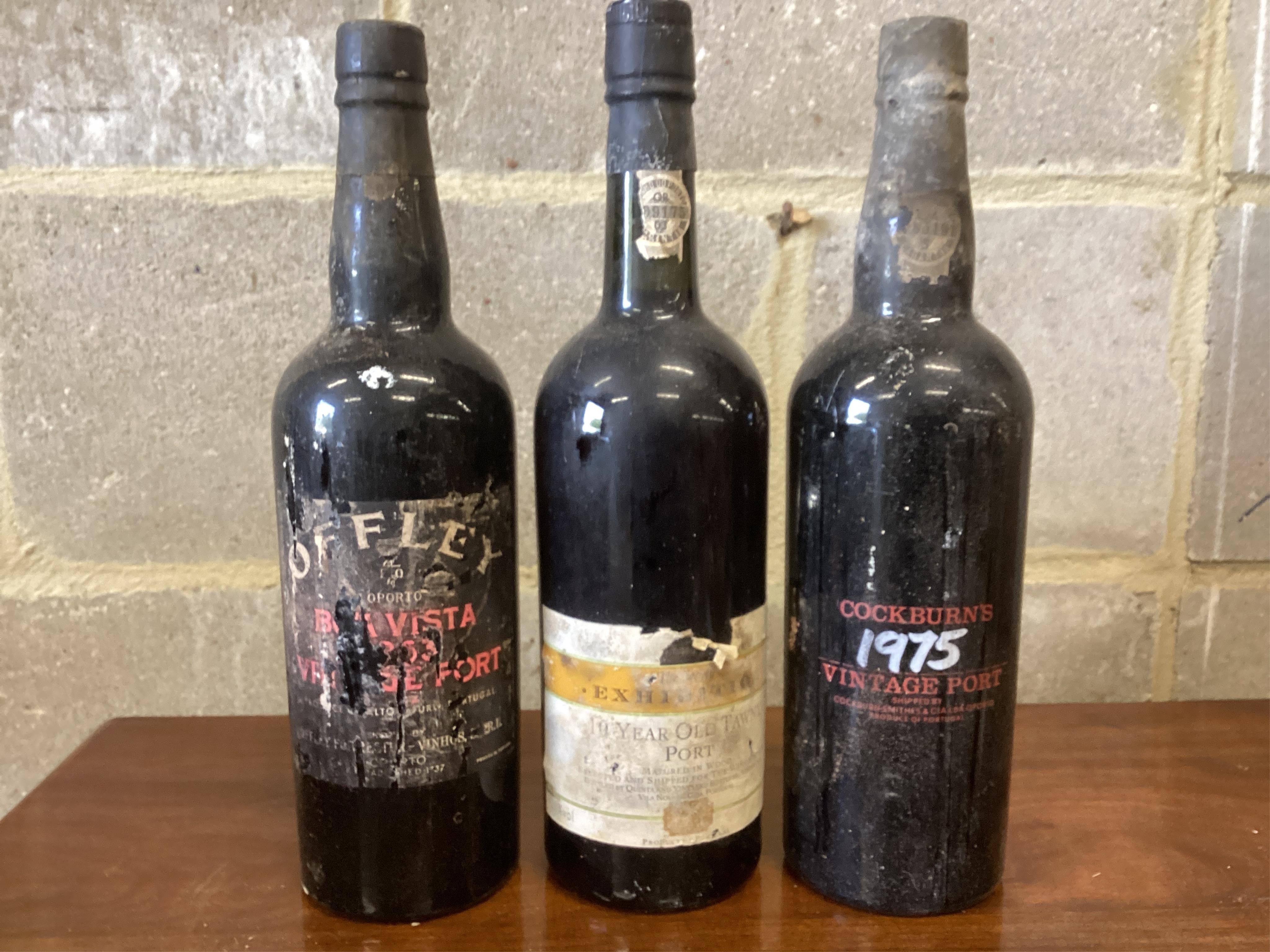 Three bottles of vintage port, Offley, Cockburn’s and Exhibition. (From a local private cellar). Condition - labels degraded